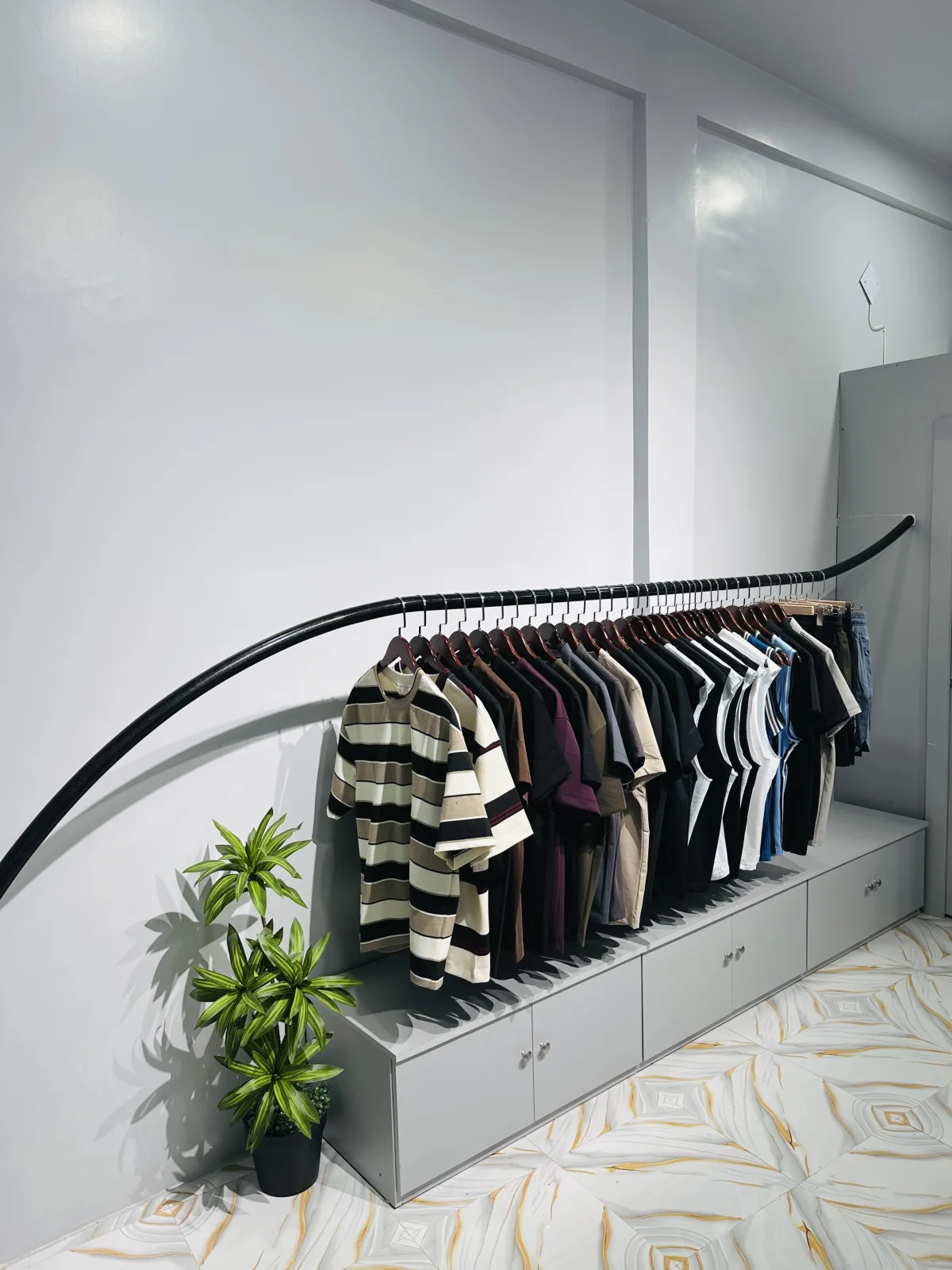 Angled view of a HEIST clothing rack